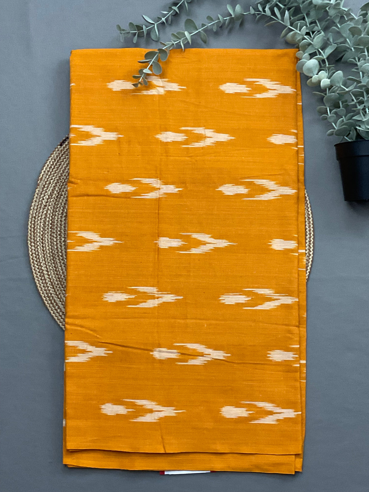 Mustard handwoven Pochampally ikkat cotton top fabric close up