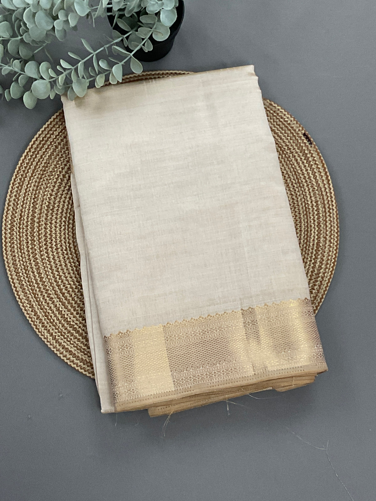 White and gold South Indian silk saree with zari pallu