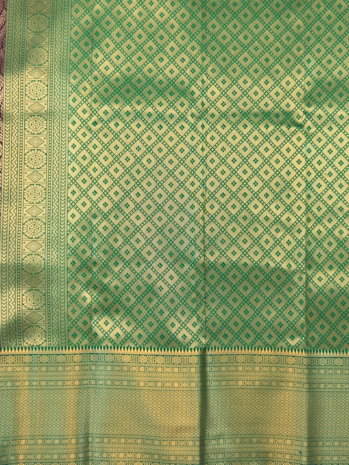 Kanchivaram golden line weaves saree in deep wine color with geometric weaves