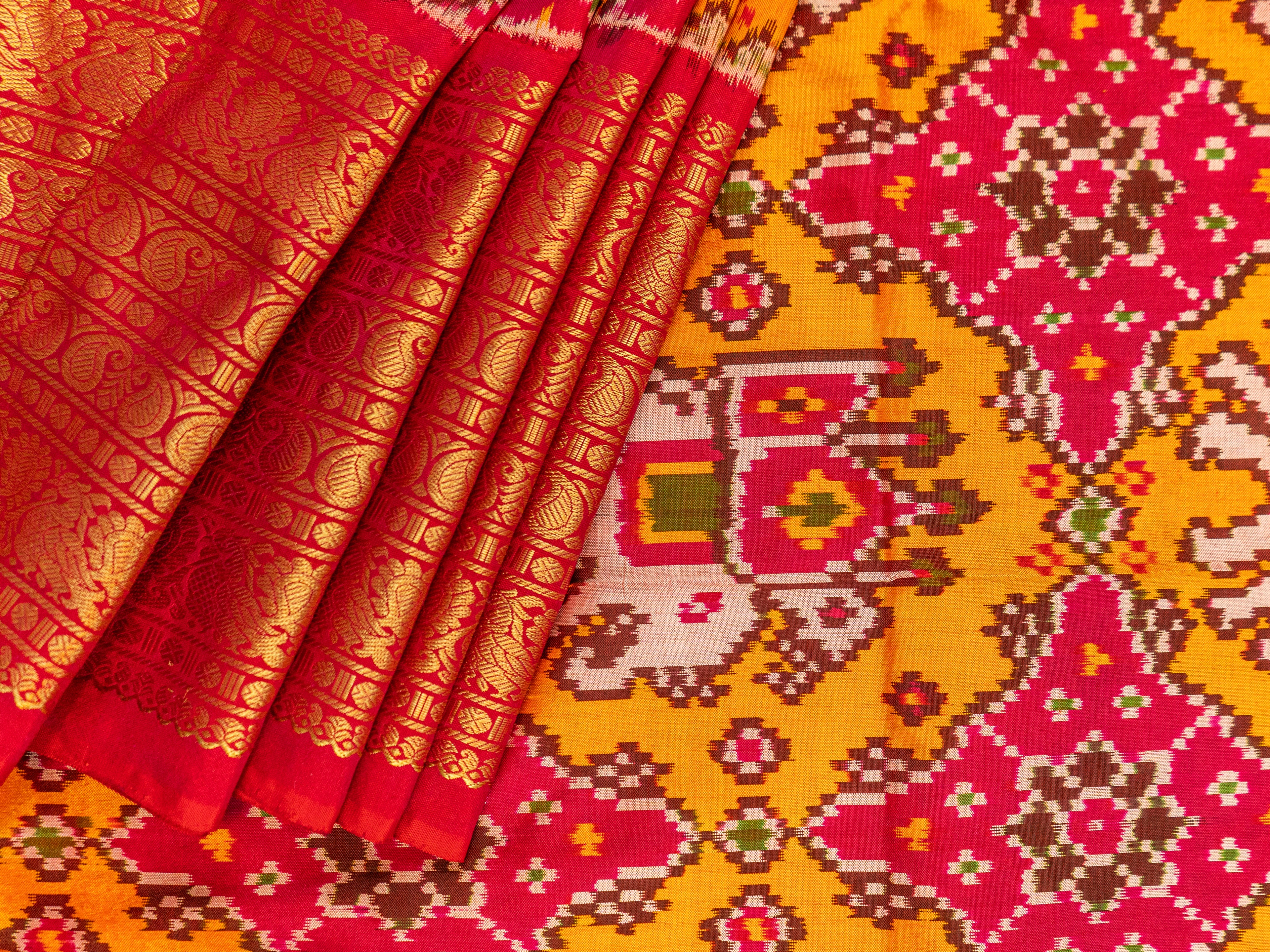 Pure Pochampally Ikat Silk Saree in Orange with Animal Motifs, Kanjivaram Border & Red Zari Pallu