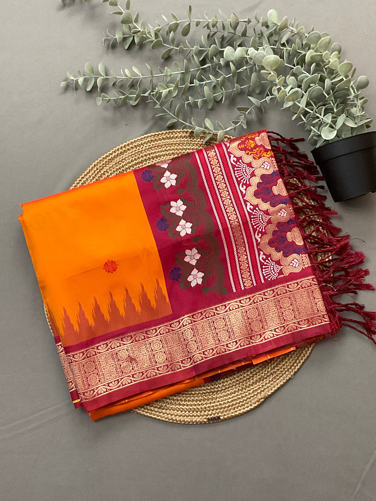 Vibrant Orange Jamdani Silk Saree with Golden Temple Border and Tassels