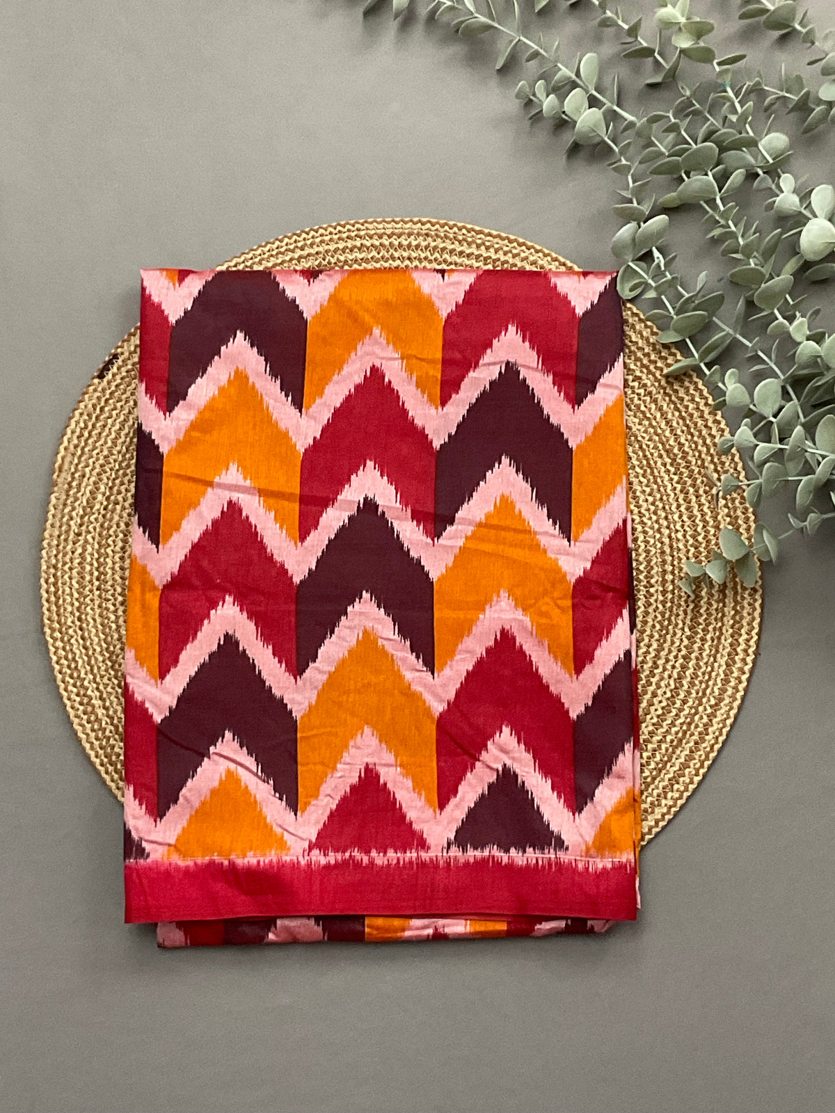 Red multicolour patola print soft silk top fabric close up