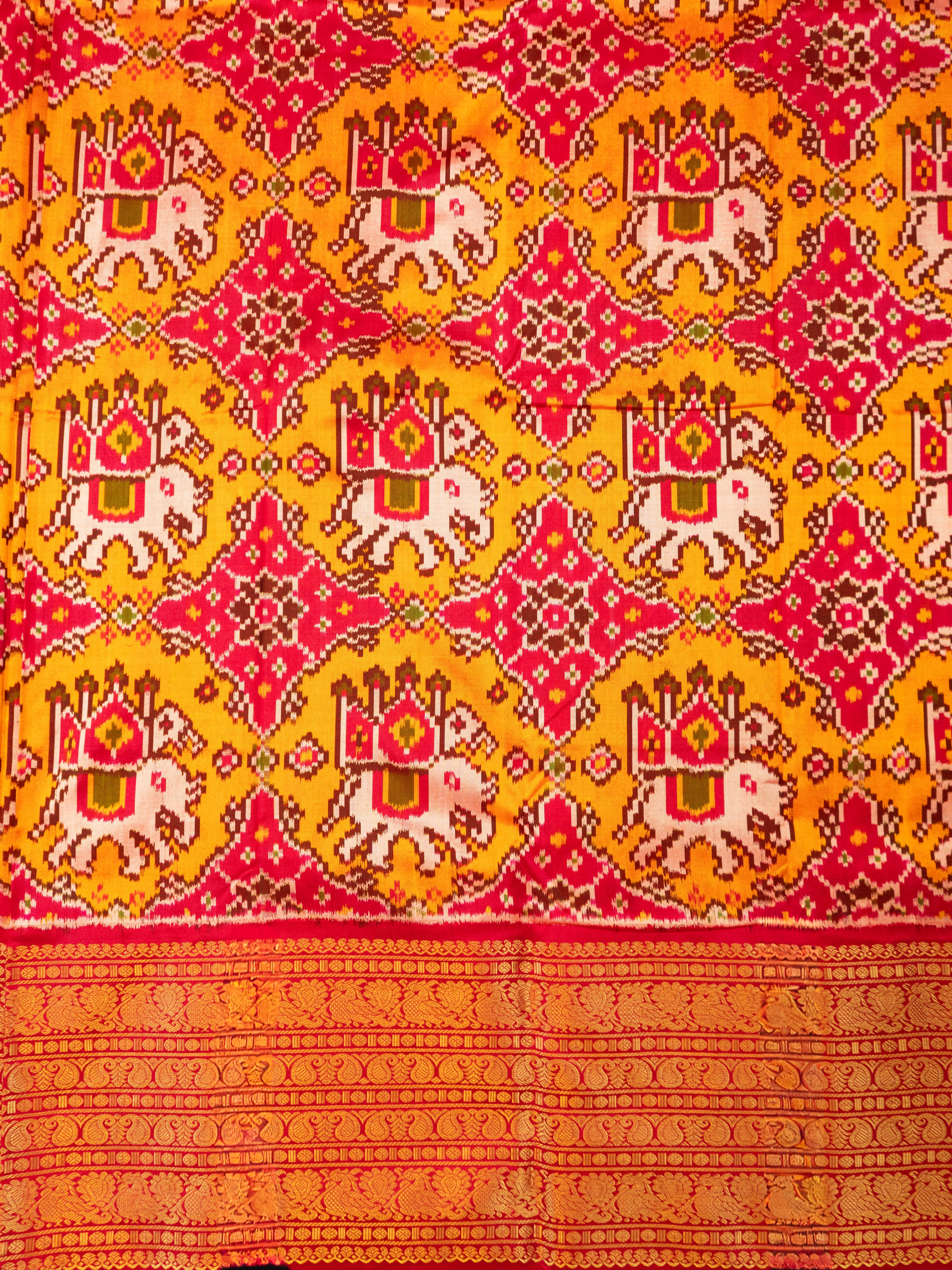 Pure Pochampally Ikat Silk Saree in Orange with Animal Motifs, Kanjivaram Border & Red Zari Pallu
