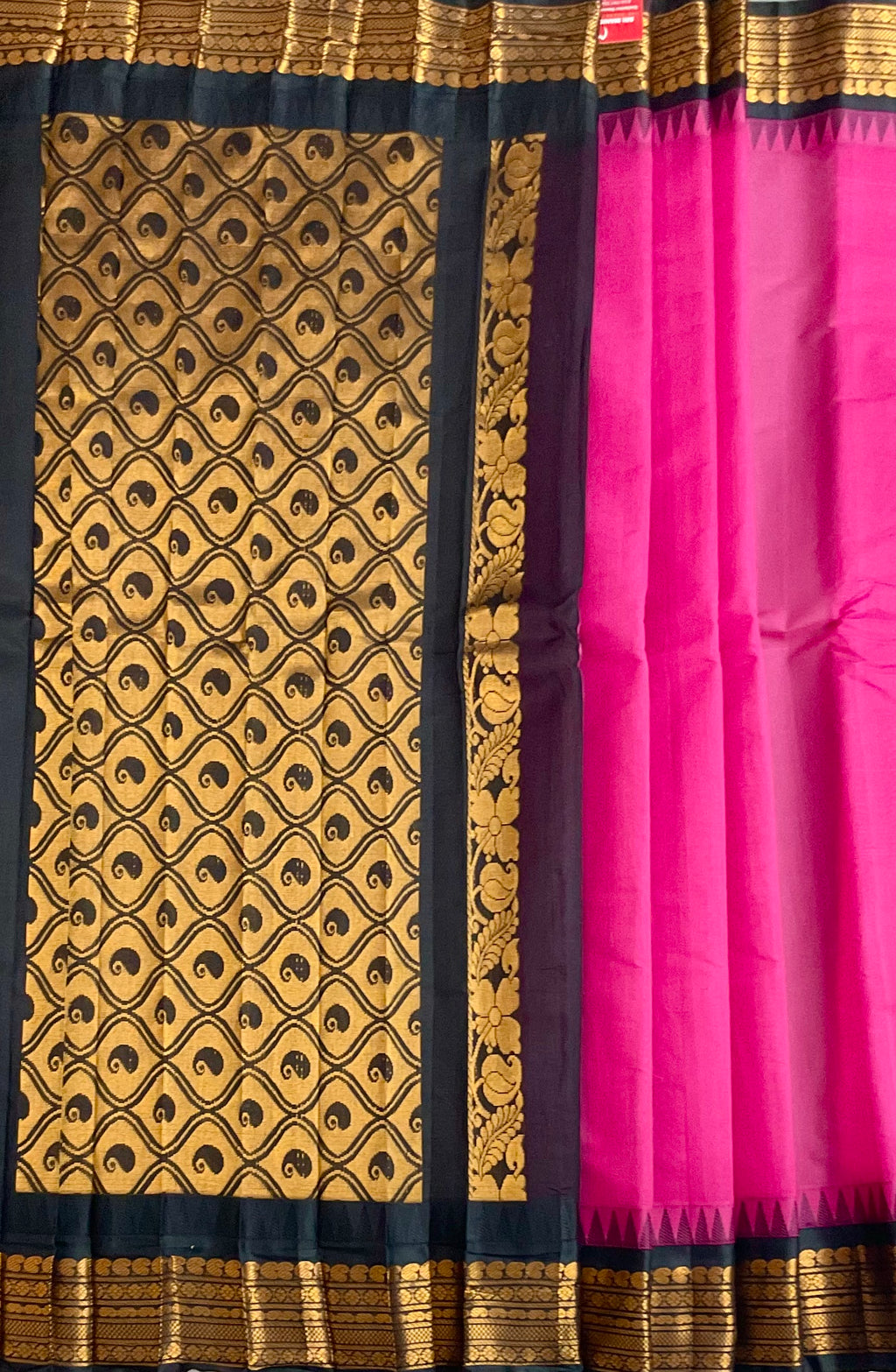 Black silk pallu and golden zari on pink Gadwal saree