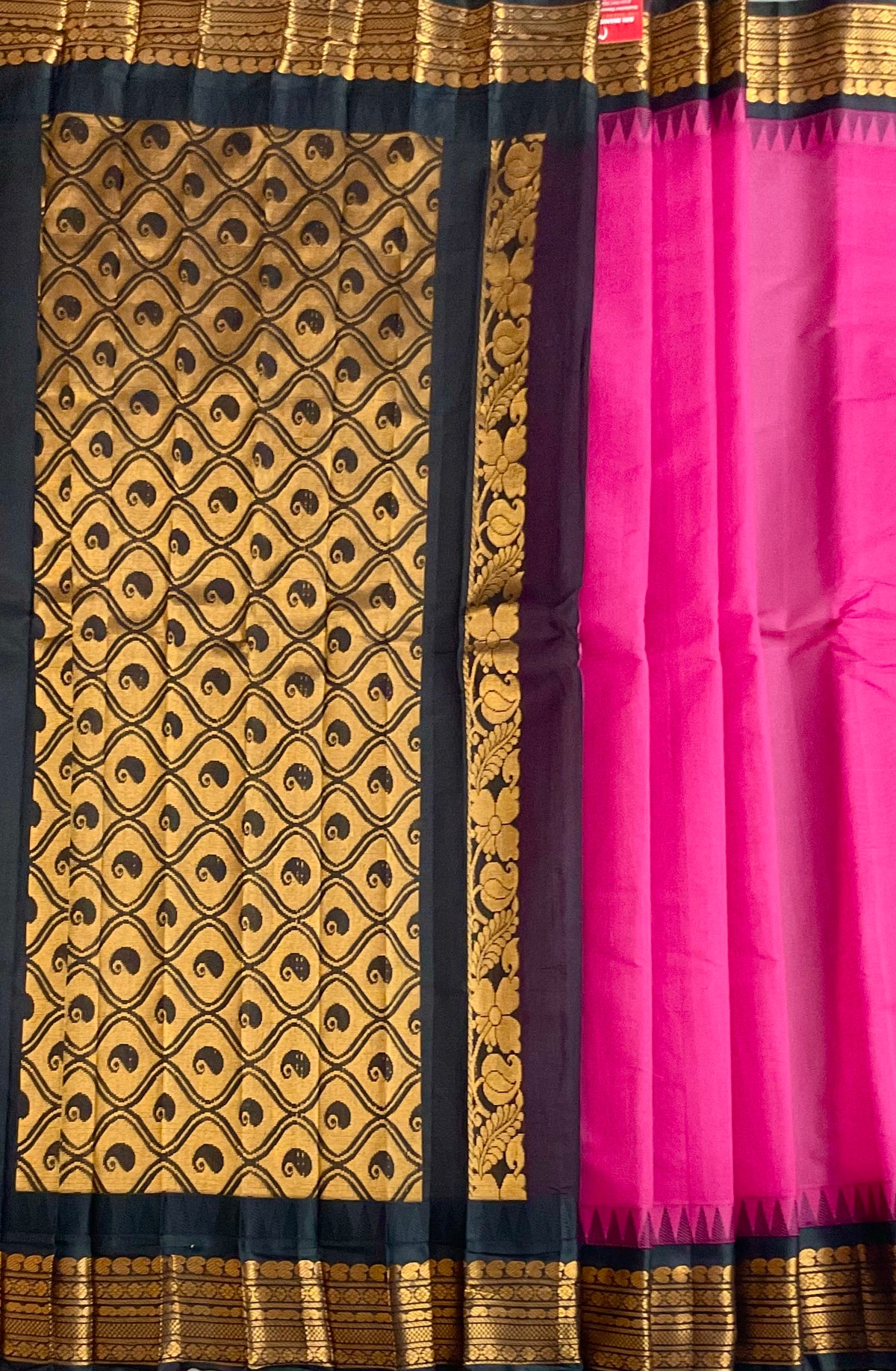 Black silk pallu and golden zari on pink Gadwal saree