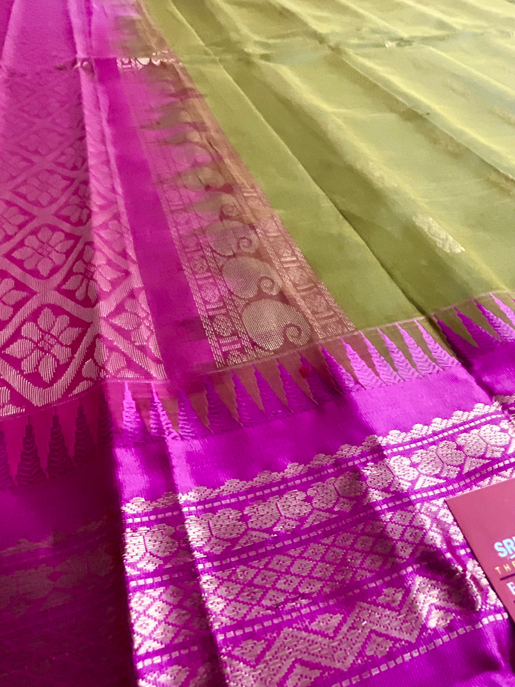 Pallu close-up of mehendi green and pink Gadwal silk saree