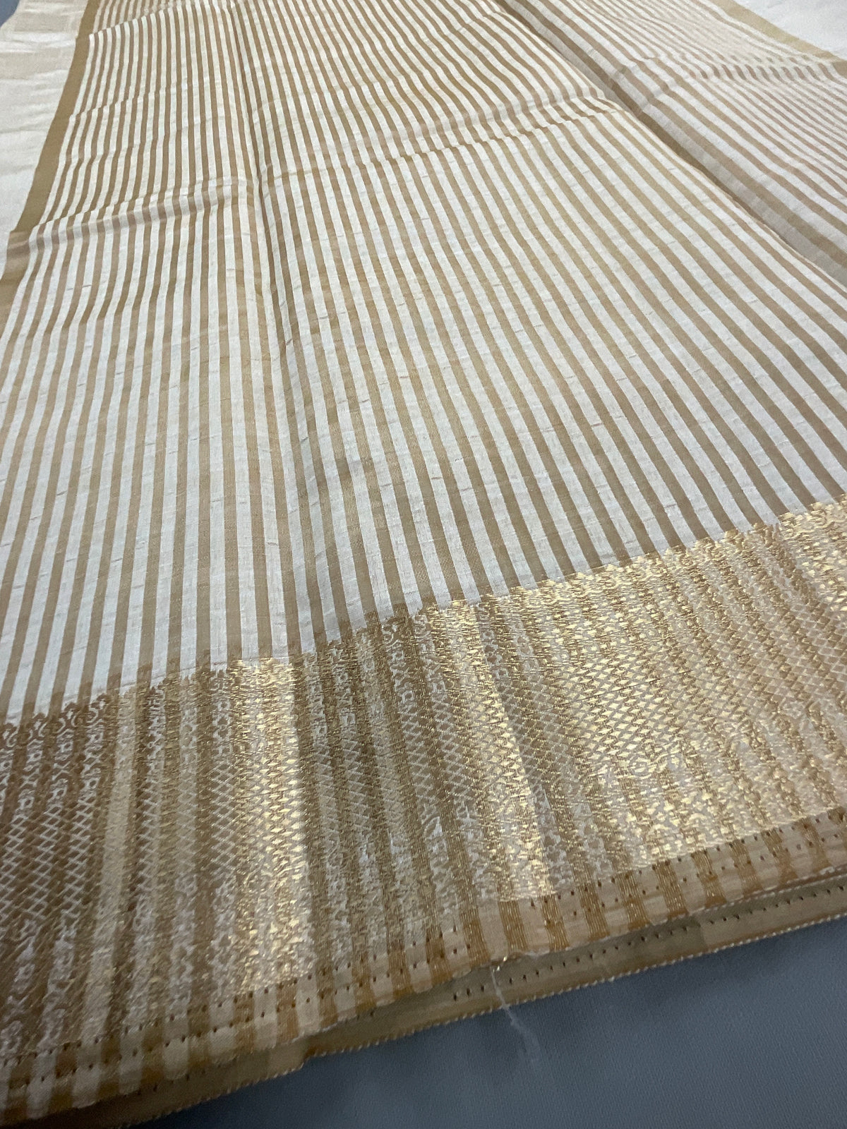 White and gold South Indian silk saree with zari pallu