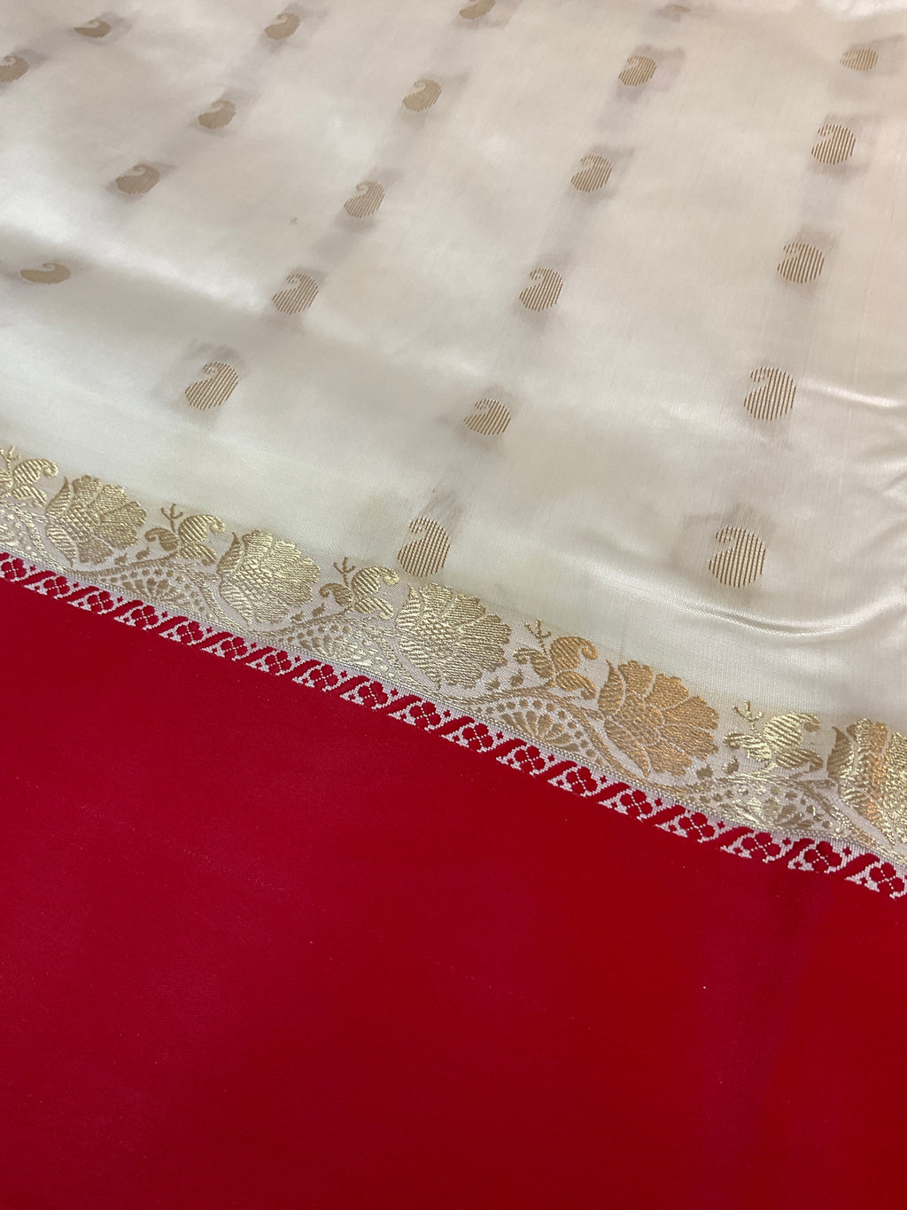 South Indian handloom silk saree with golden zari in a white and red colour contrast with plain blouse
