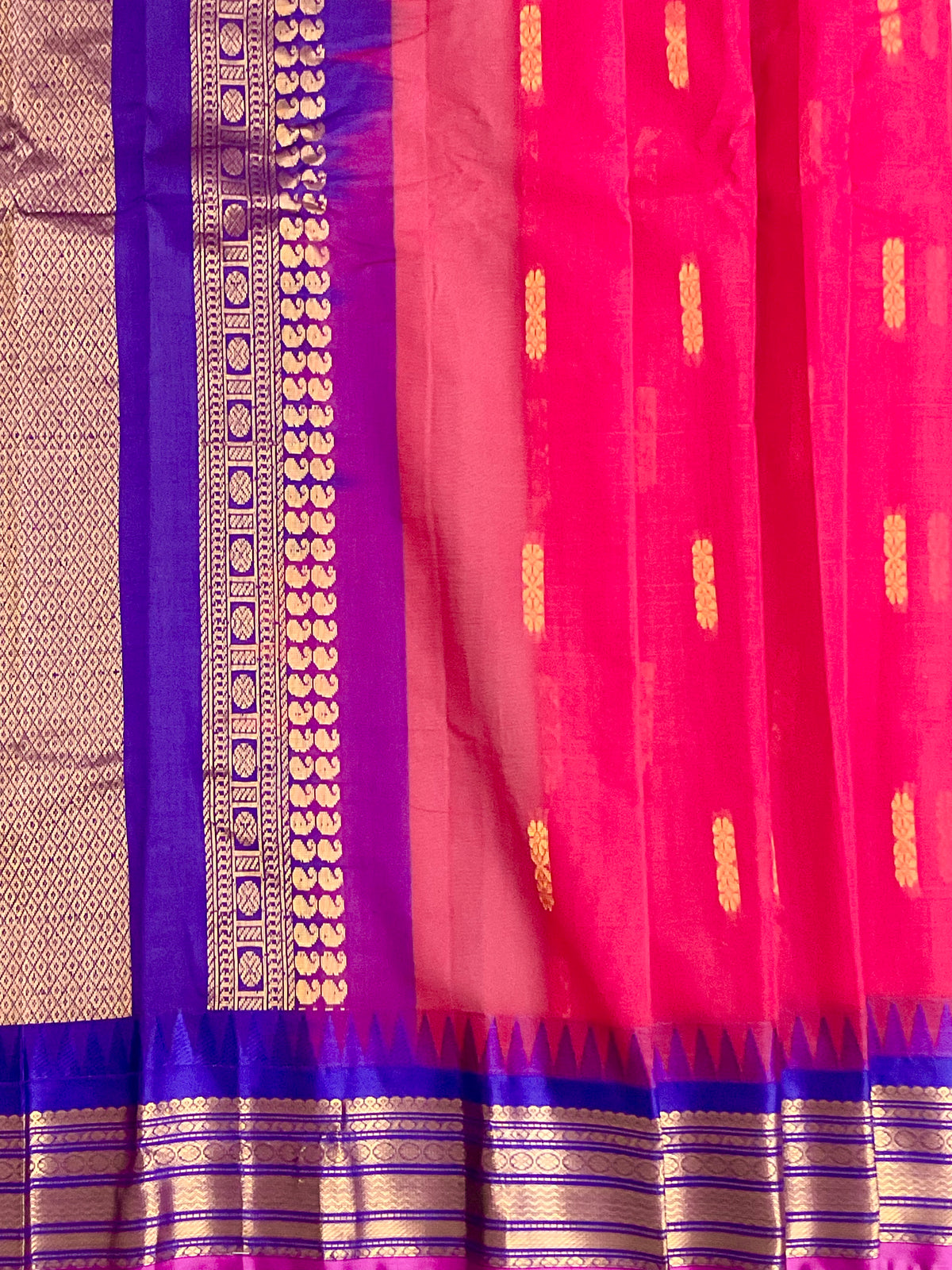 Purple silk pallu and golden zari on red Gadwal saree