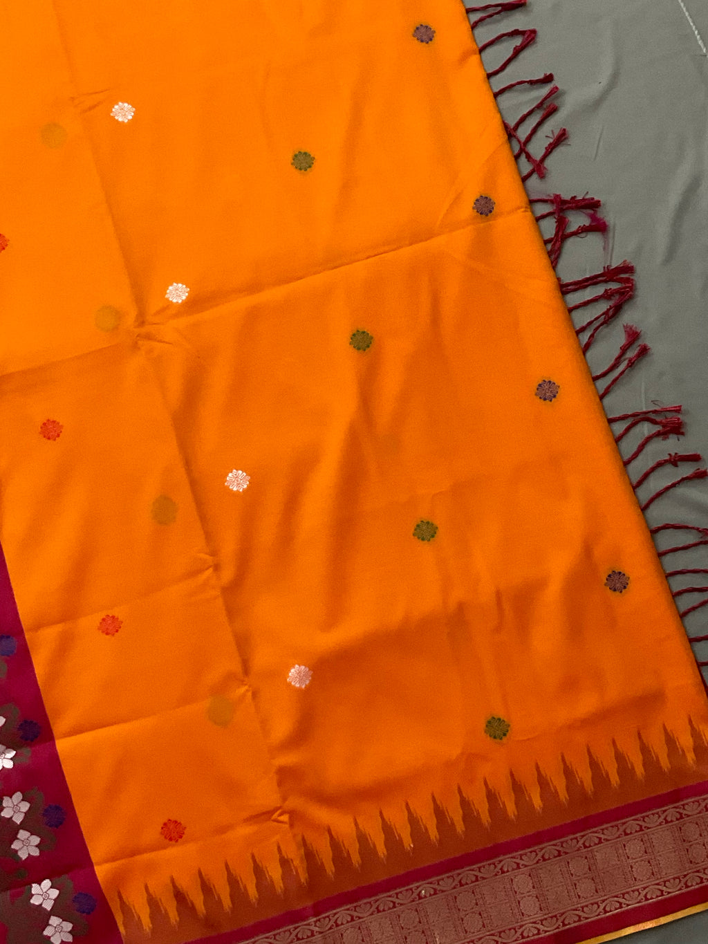 Vibrant Orange Jamdani Silk Saree with Golden Temple Border and Tassels