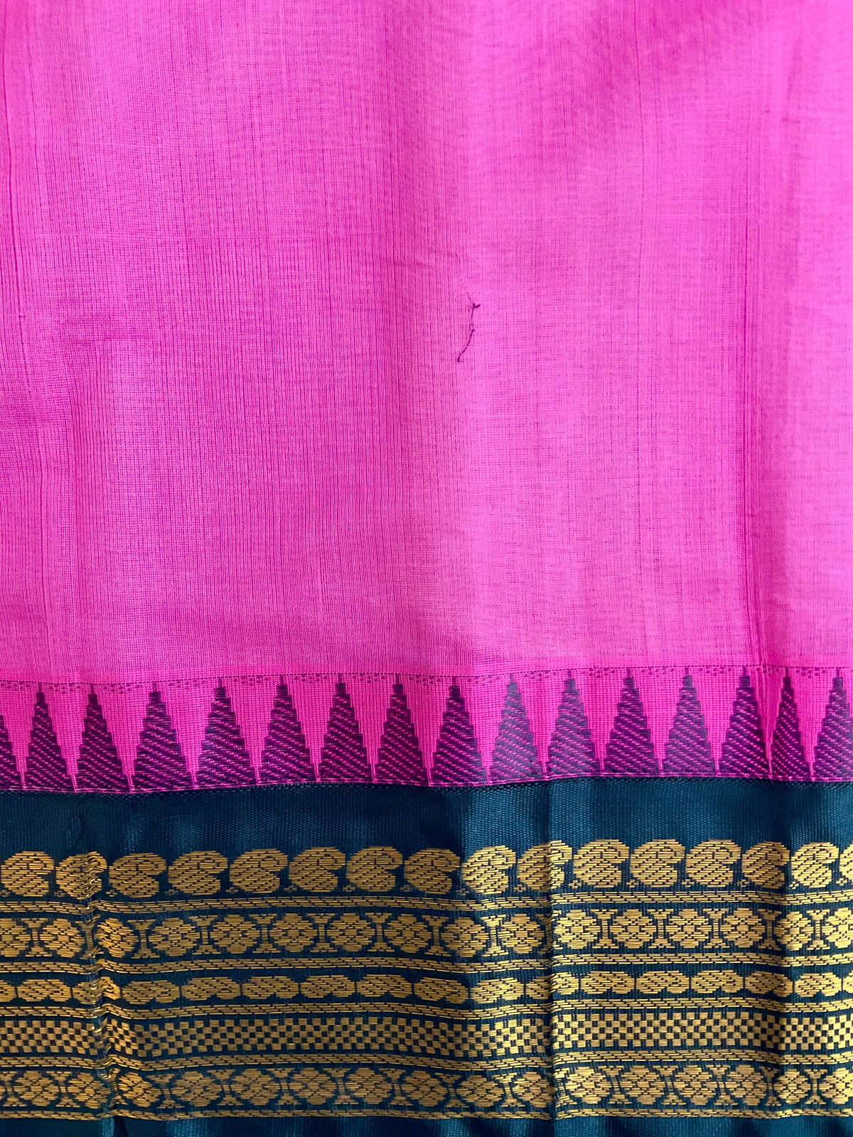 Draped pink Gadwal silk saree with black border and golden zari