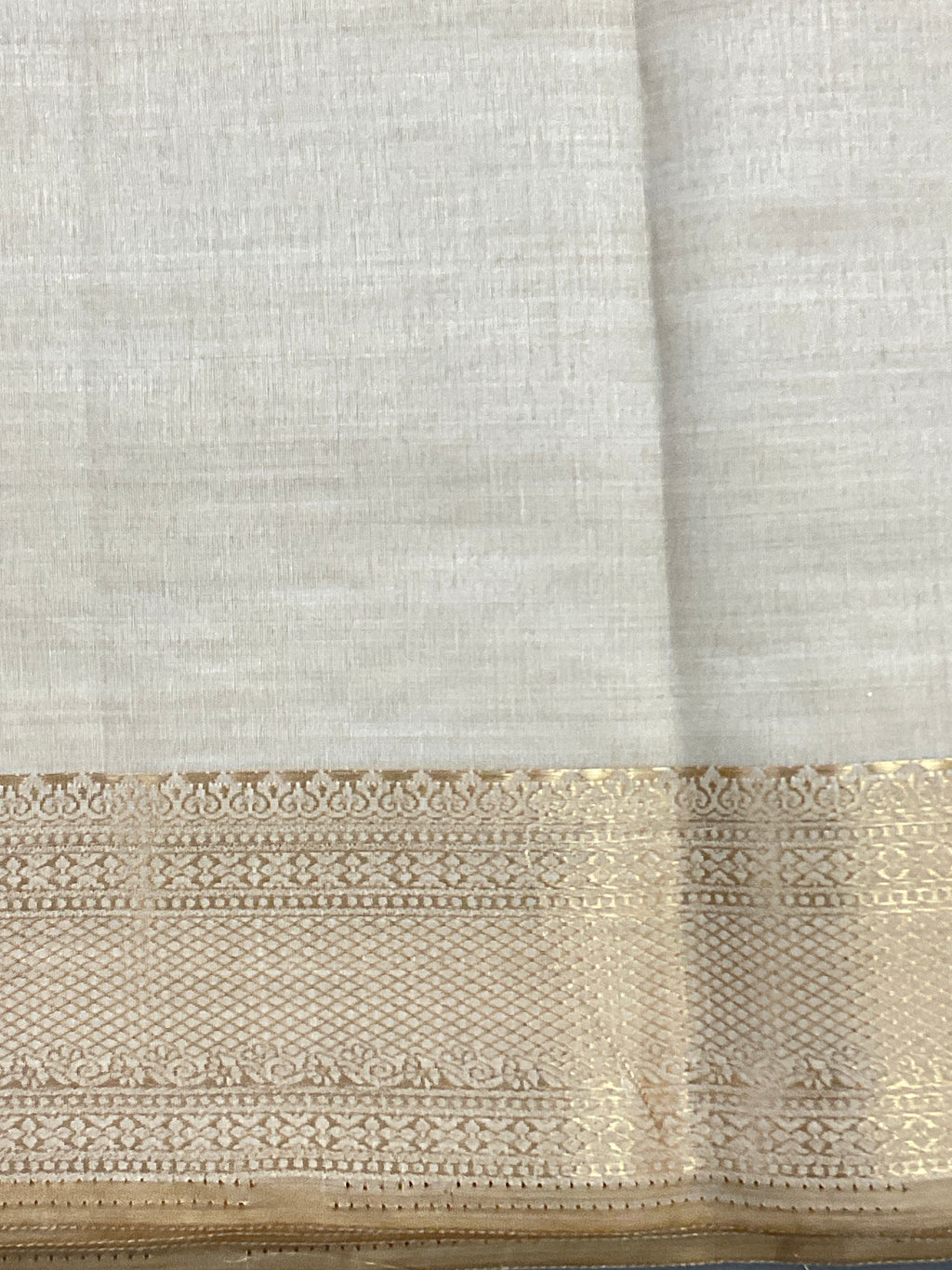 White and gold South Indian silk saree with zari pallu