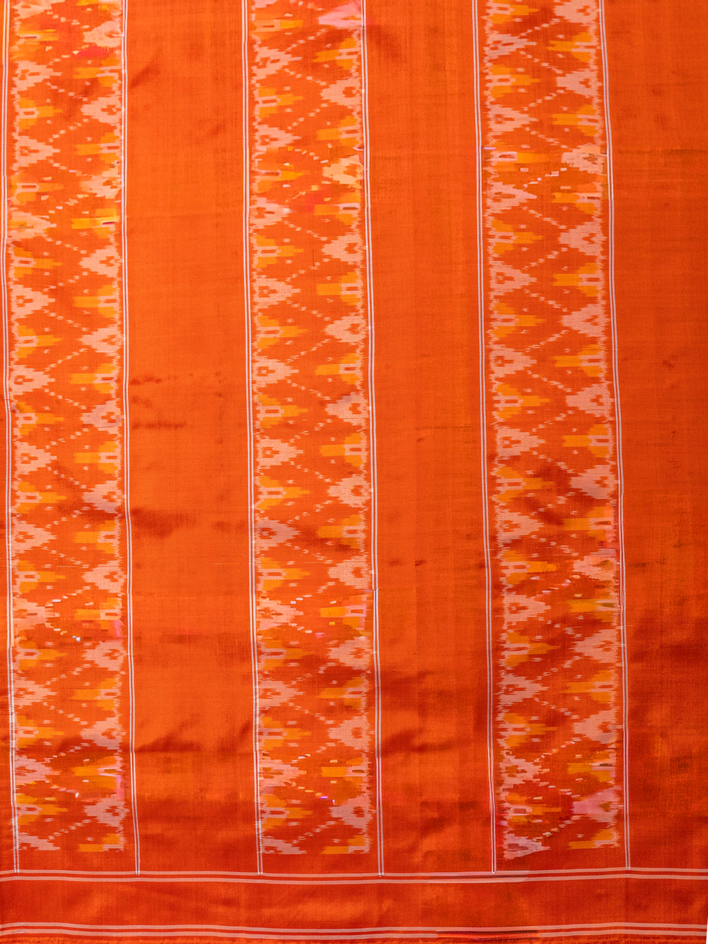 Pure Pochampally Silk Saree in Black with Orange Ikat Pallu & Border