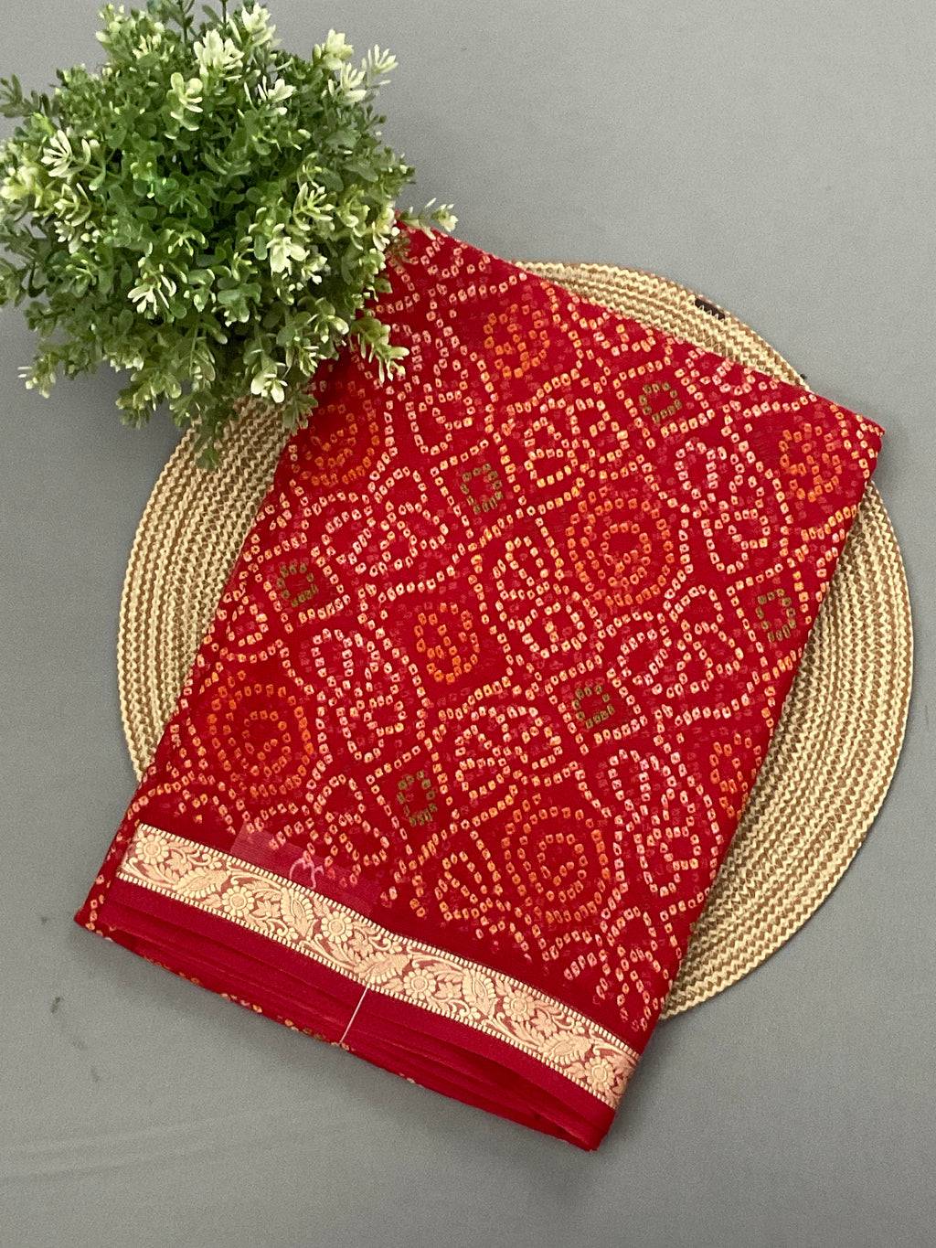 Red Bandini printed georgette saree with golden weaving border and designer pallu