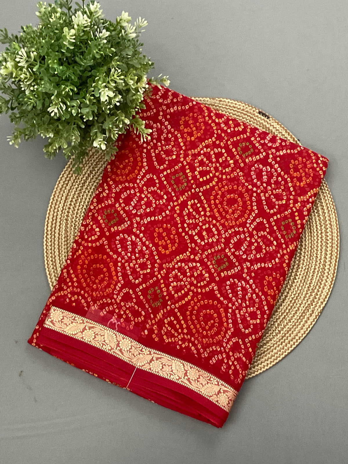Red Bandini printed georgette saree with golden weaving border and designer pallu