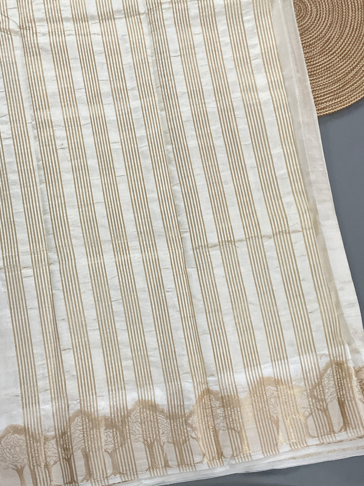 White and gold silk saree with designer border