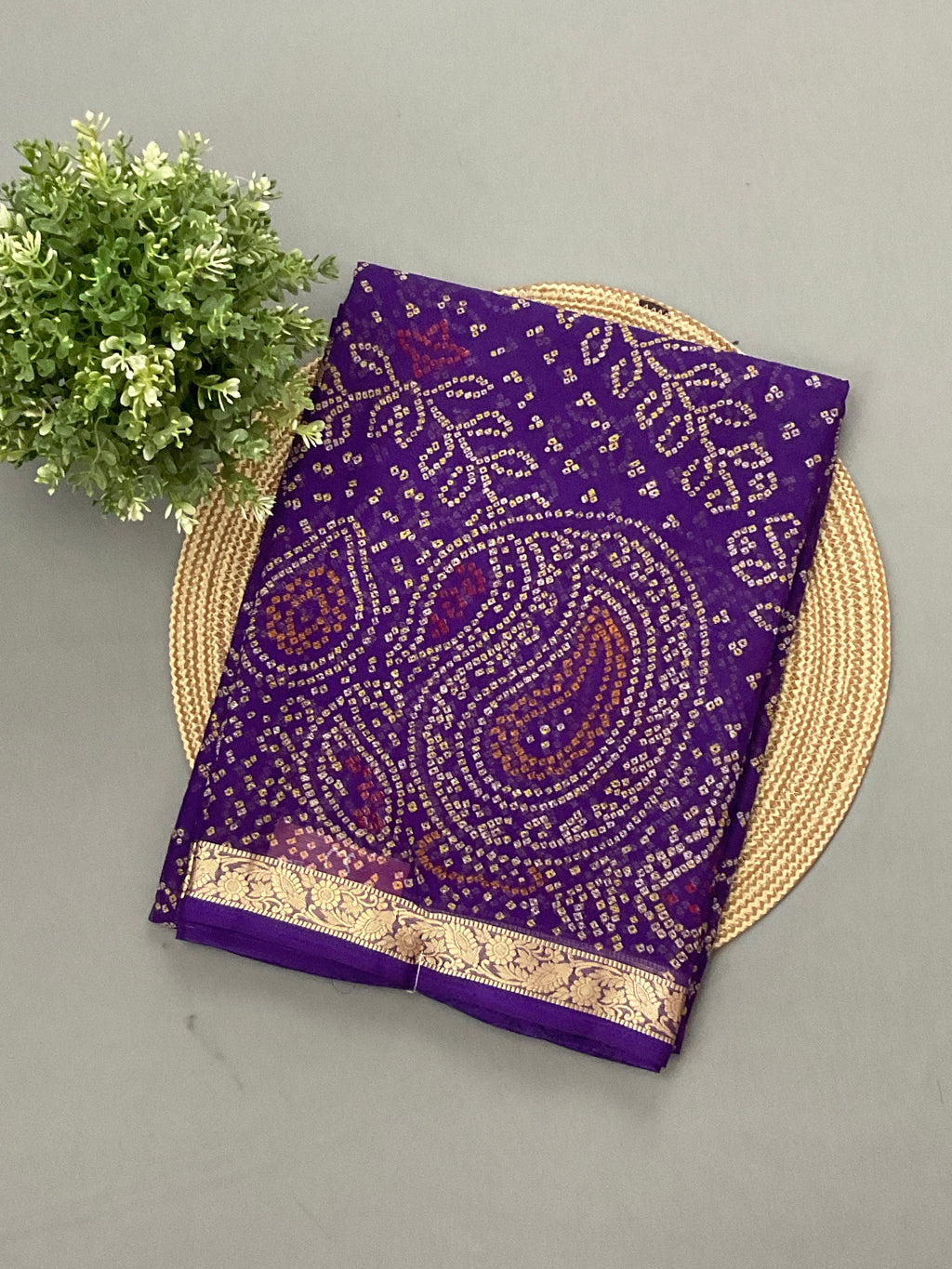 Purple Bandini printed georgette saree with golden weaving border and designer pallu