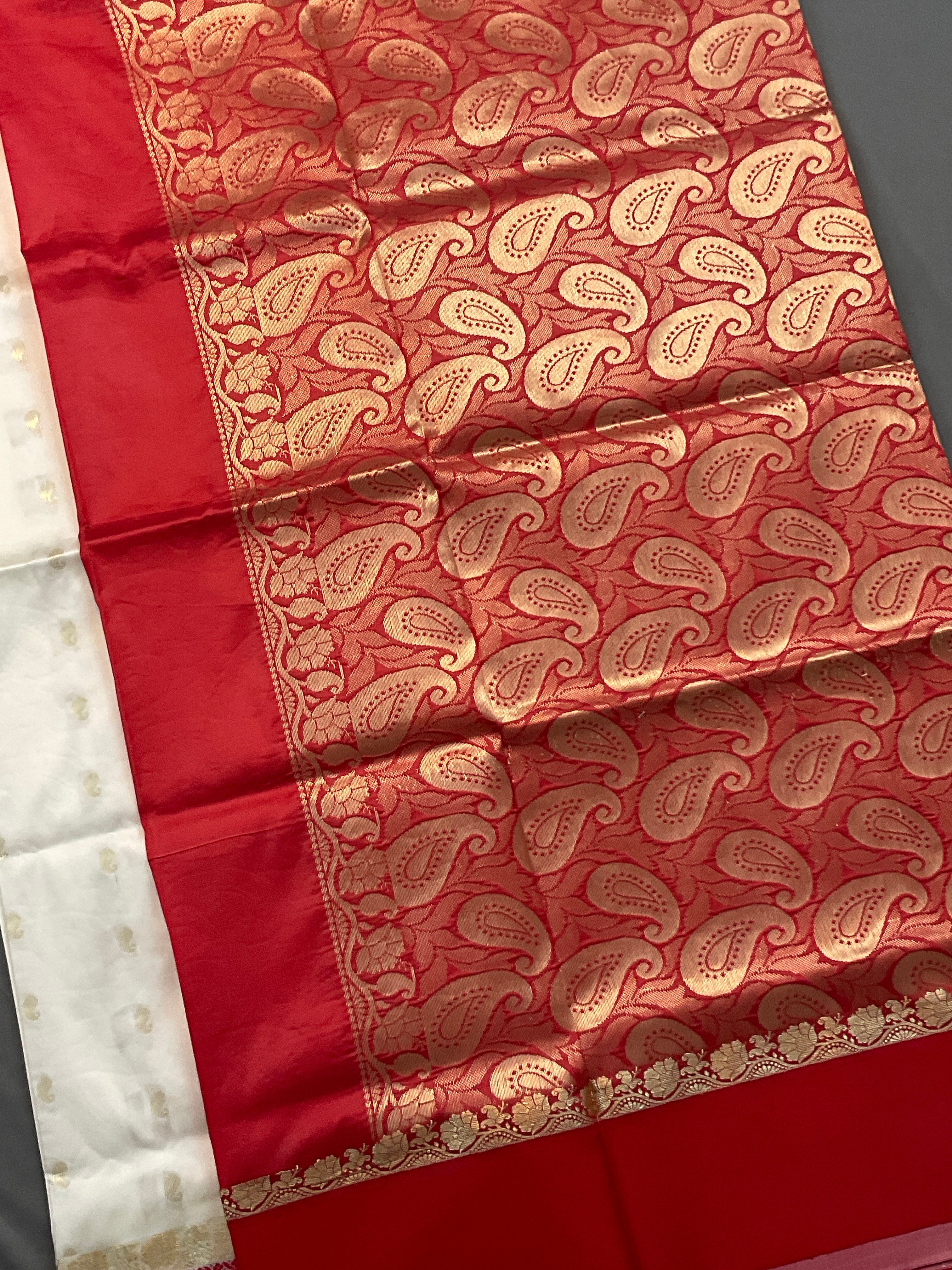 South Indian handloom silk saree with golden zari in a white and red colour contrast with plain blouse