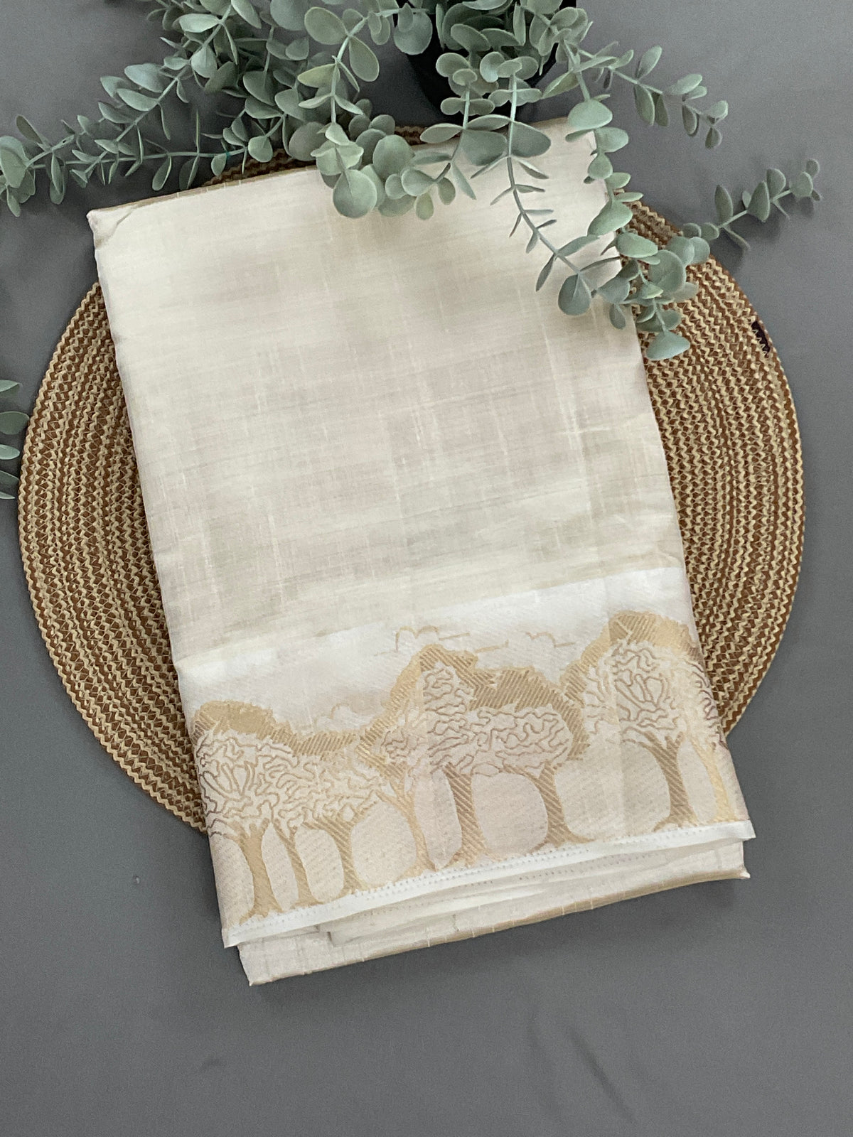 White and gold silk saree with designer border