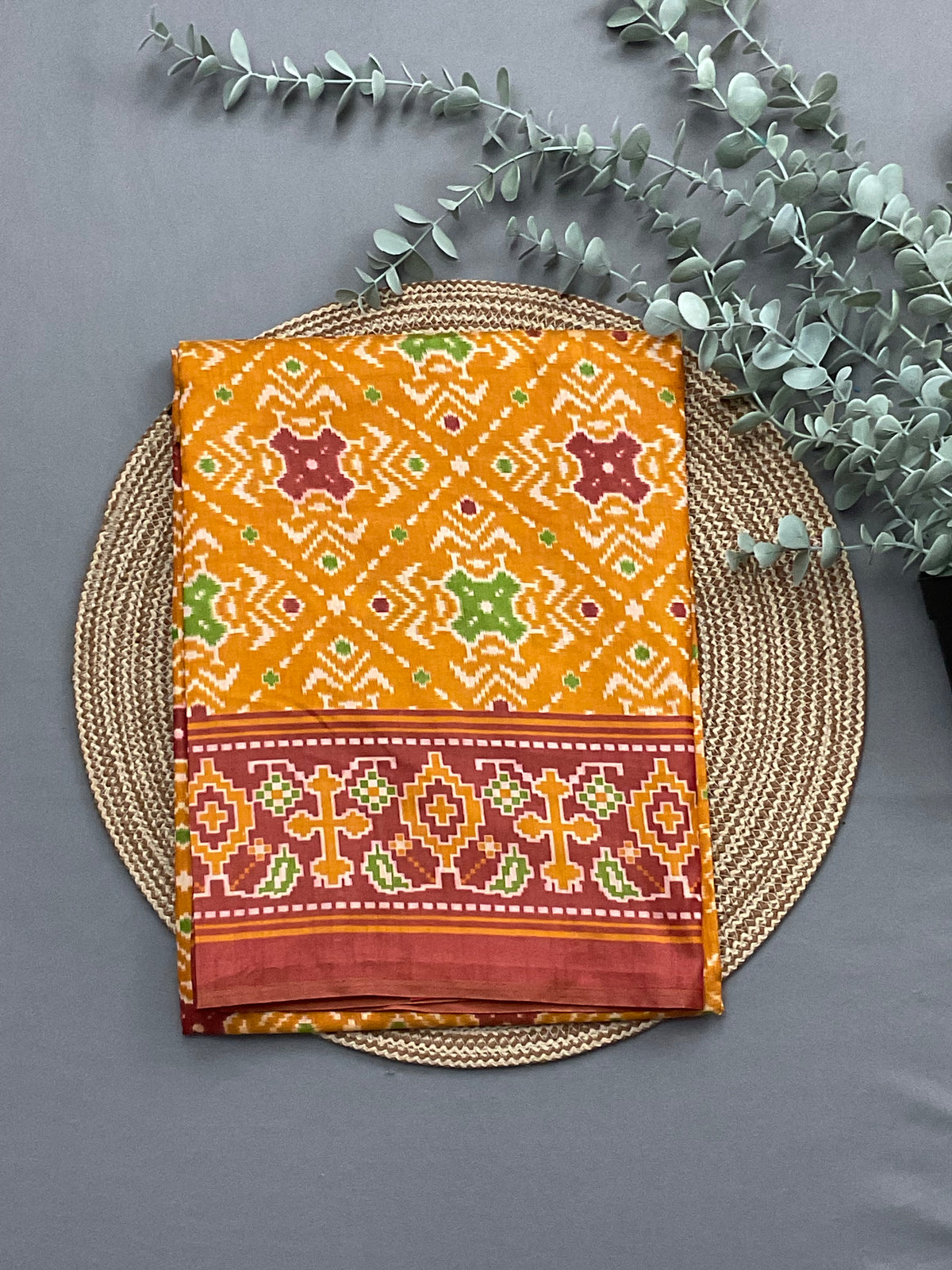 Mustard patola print soft silk top fabric close up