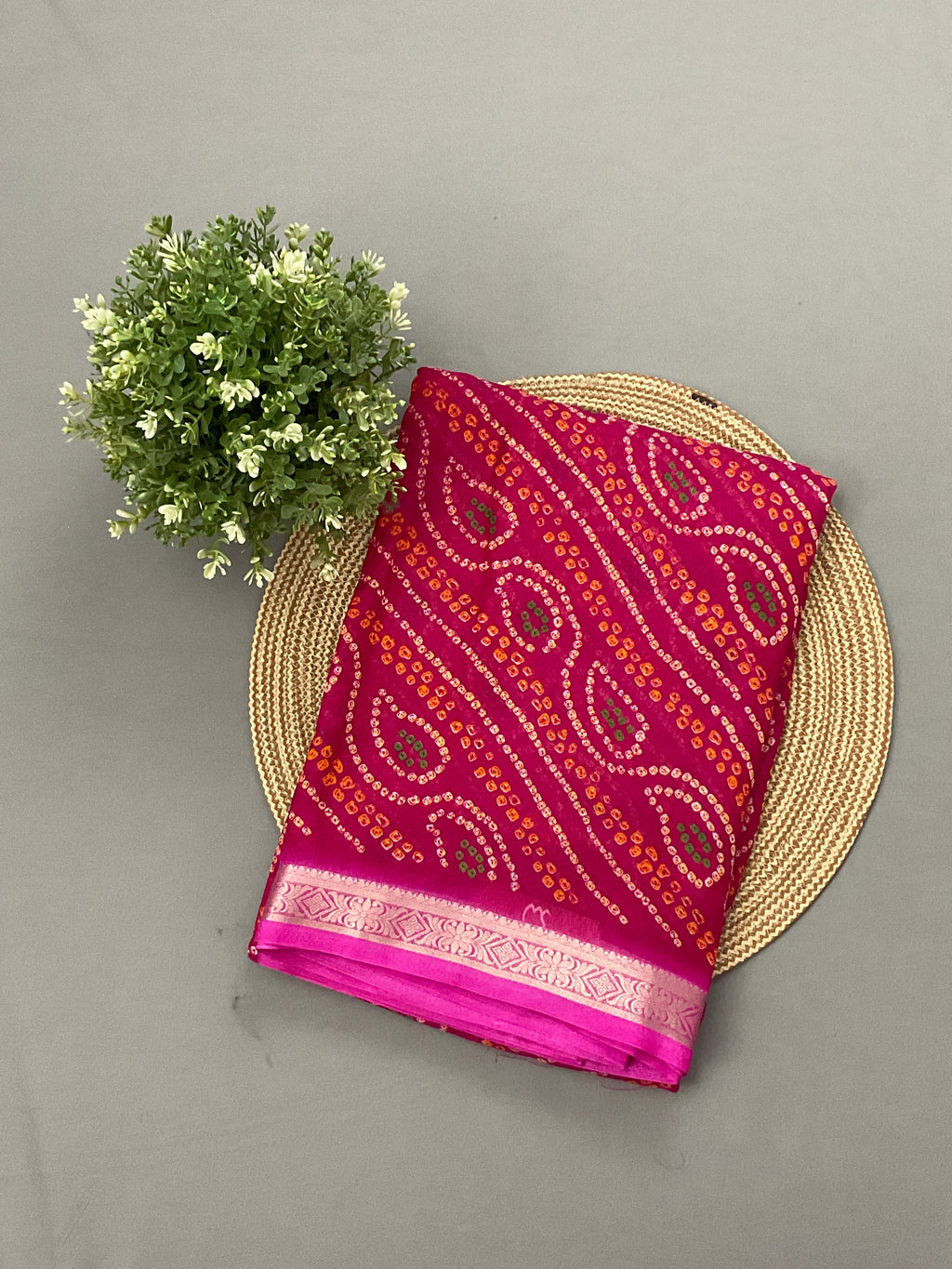 Pink Bandini printed georgette saree with golden weaving border and designer pallu