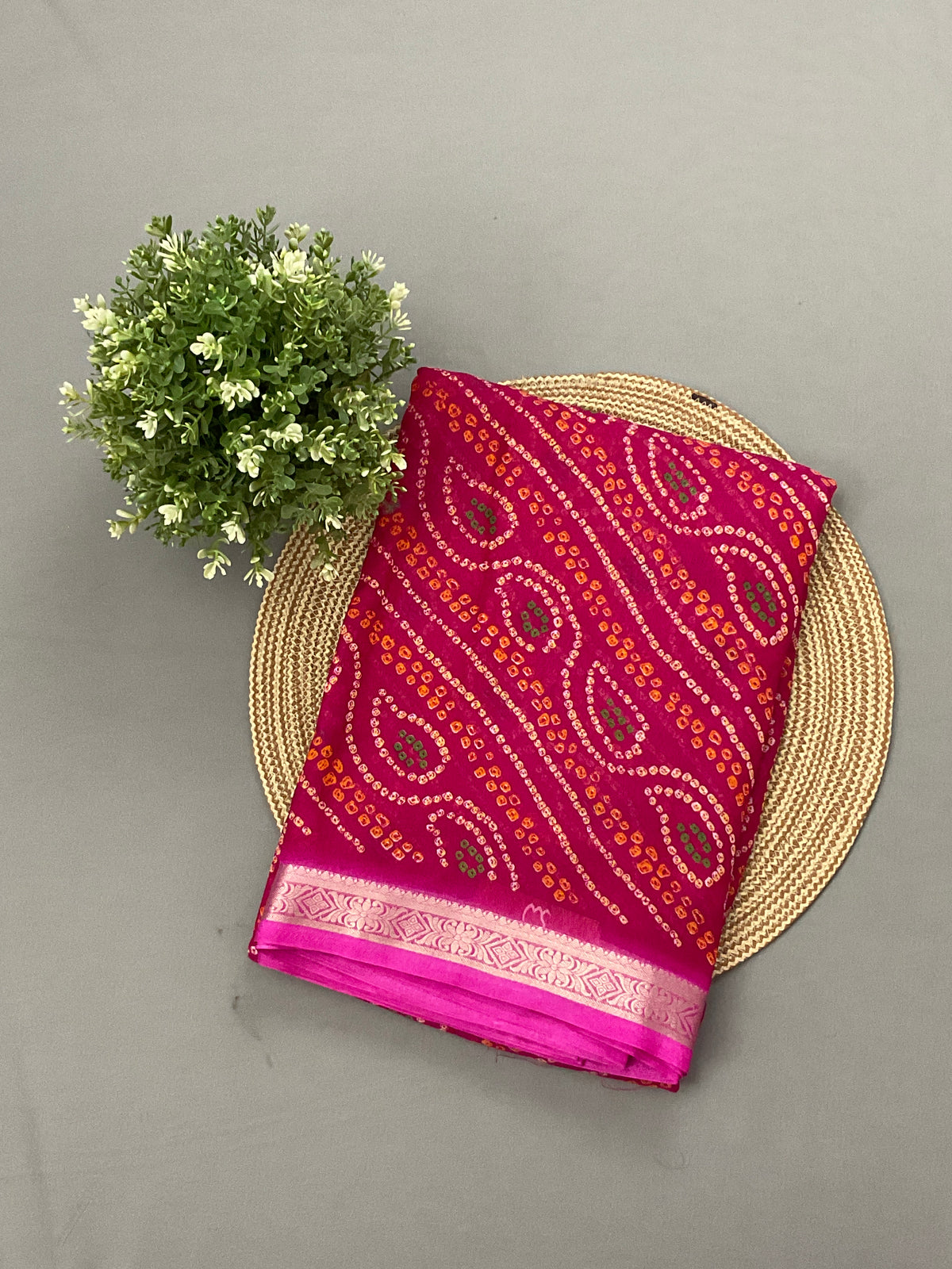 Pink Bandini printed georgette saree with golden weaving border and designer pallu