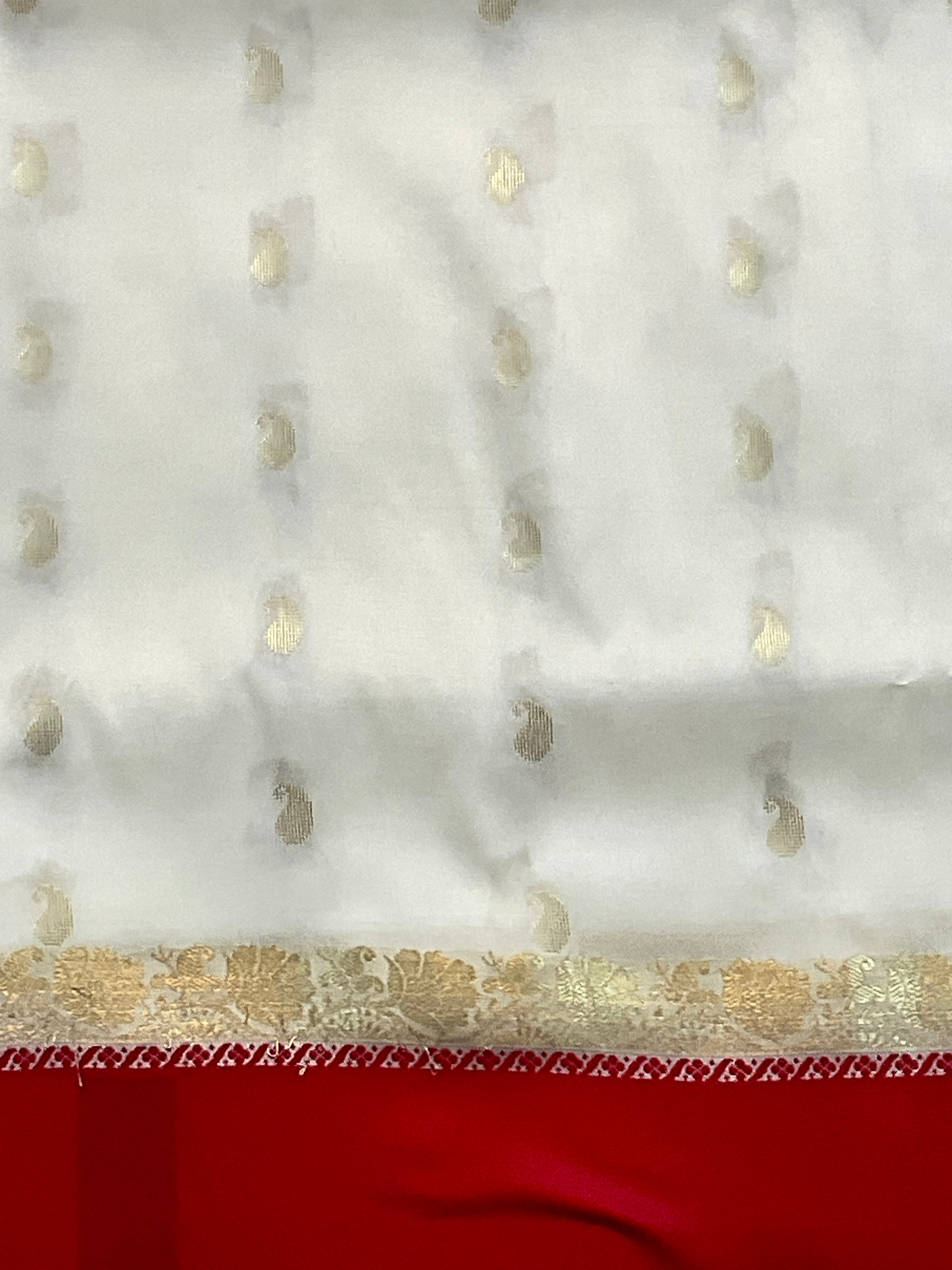 South Indian handloom silk saree with golden zari in a white and red colour contrast with plain blouse