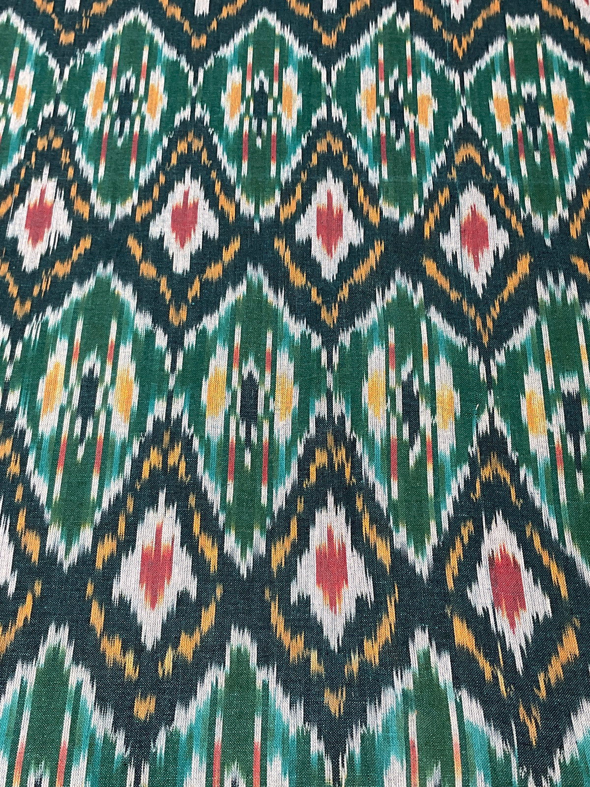 Multicolour Pochampally Ikkat Cotton Fabric – Green Base (Per Metre)