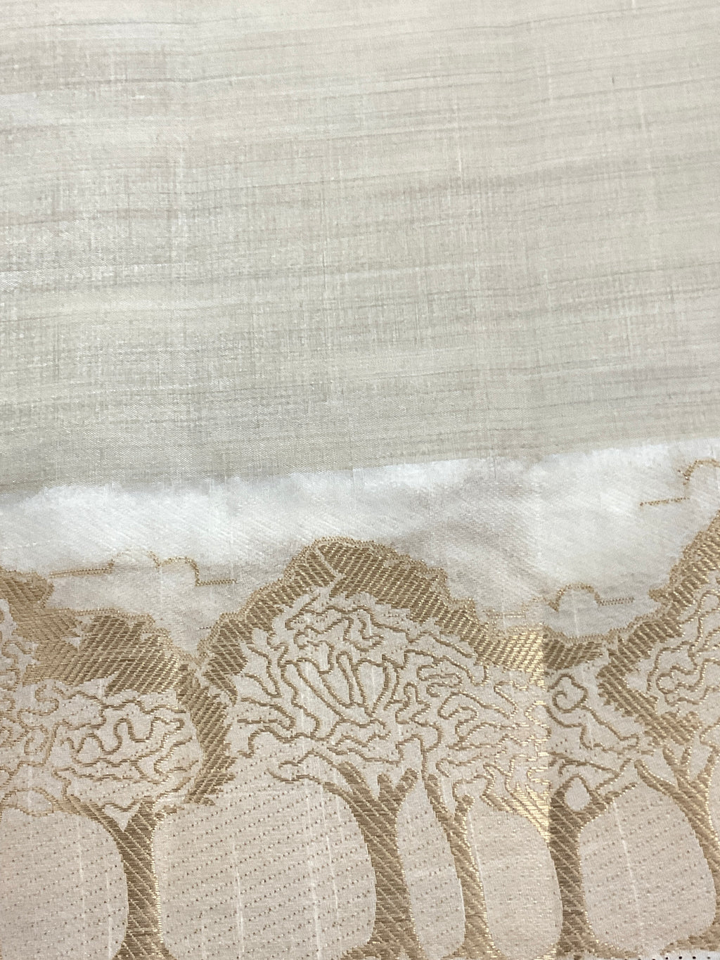 White and gold silk saree with designer border