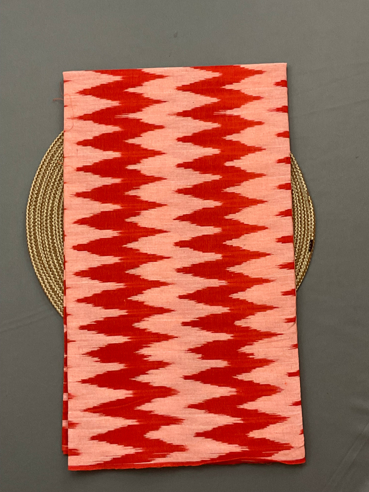 Orange and white Pochampally ikat handloom cotton top fabric close up