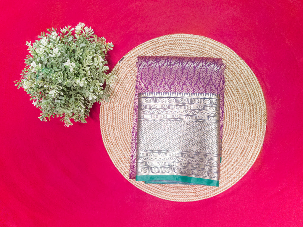 Kanchivaram golden line weaves saree in deep wine color with geometric weaves