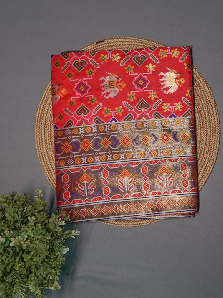 Decorative ikkat intricate patterns on a red background with green contrast