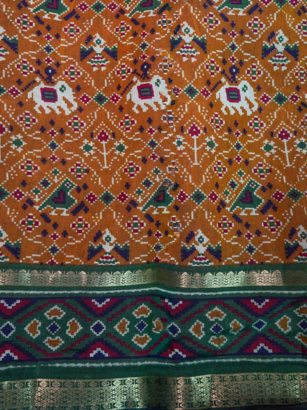Orange patola silk saree detail